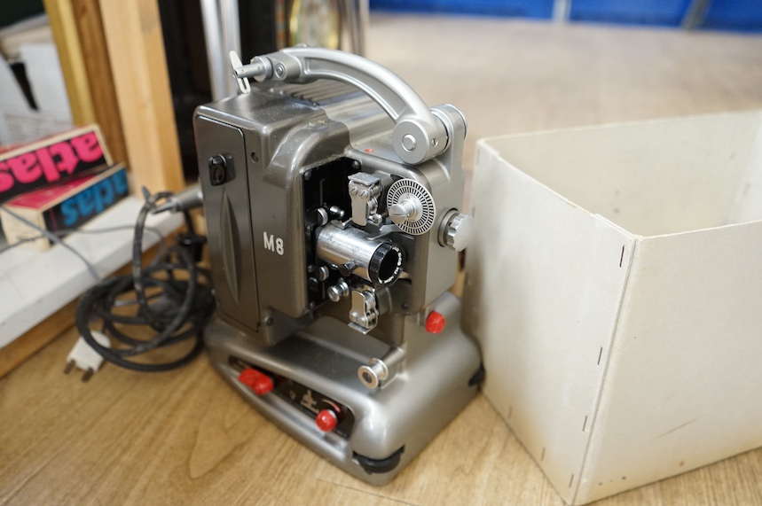 A Bolex Paillard 8mm cinefilm projector, a 1960s slide projector and a vintage radio. Condition - varies